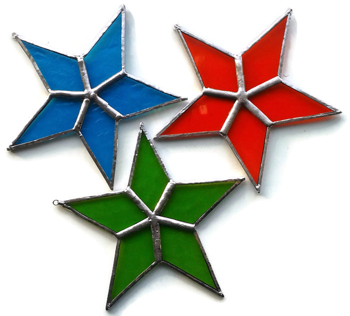 Stained glass stars are available as ready to post items as well as an in person class at the Dragon Hole www.bluekatdesign.weebly.com